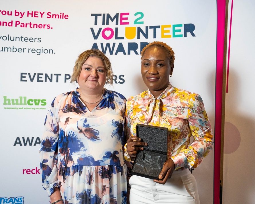 Ayosola standing with the Award Sponsor after having accepted the Award.