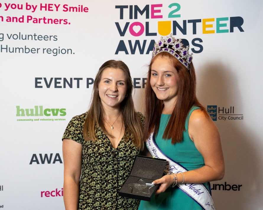 Shelby'j standing with the Award Sponsor after having accepted the Award.