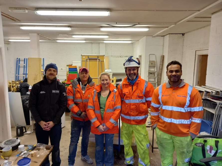 Volunteers from Balfour Beatty stand and pose in the Hull Vault